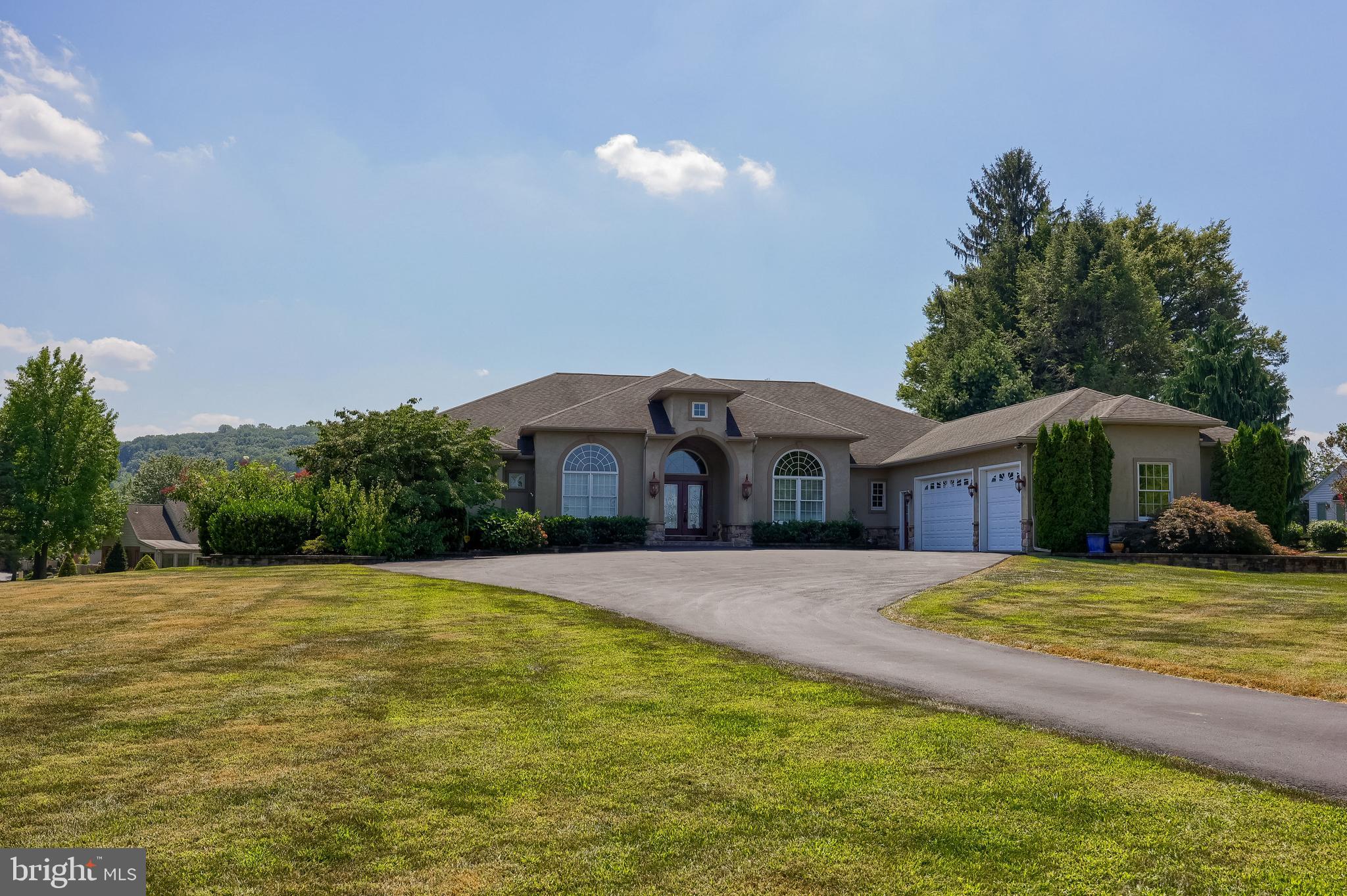 890 Fishburn Road Hershey, PA 17033 - Photo 90 of 103 a front view of a house with a yard and garage