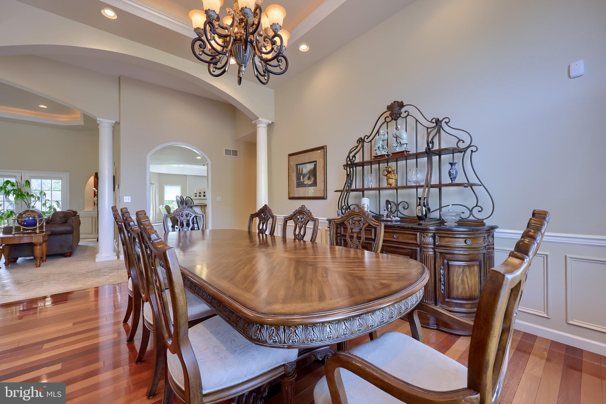 890 Fishburn Road Hershey, PA 17033 - Photo 9 of 103 a dining room with furniture a chandelier and wooden floor