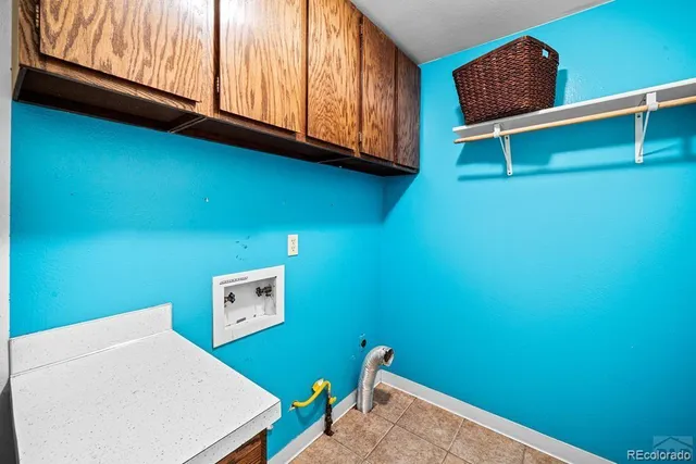 a room with a window and a book shelf