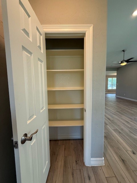 1541 Primrose Street Conroe, TX 77385 - Photo 10 of 25 a view of walk in closet with empty racks