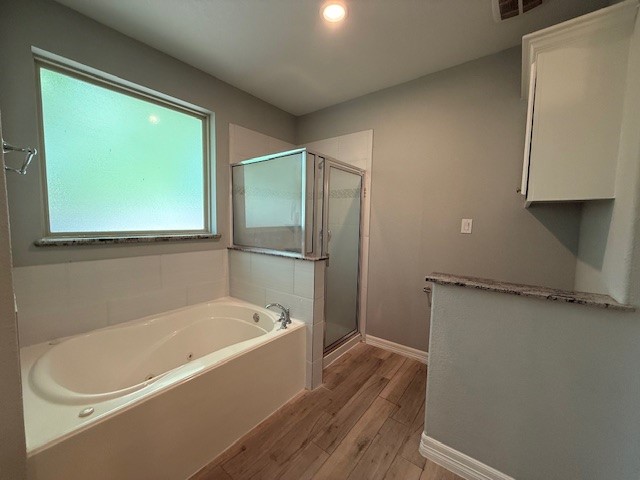 1541 Primrose Street Conroe, TX 77385 - Photo 14 of 25 a white bath tub sitting next to a window