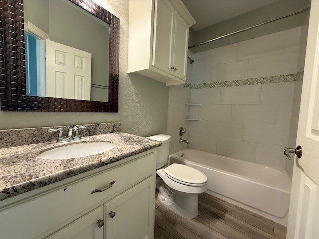 1541 Primrose Street Conroe, TX 77385 - Photo 21 of 25 a bathroom with a granite countertop sink toilet and shower