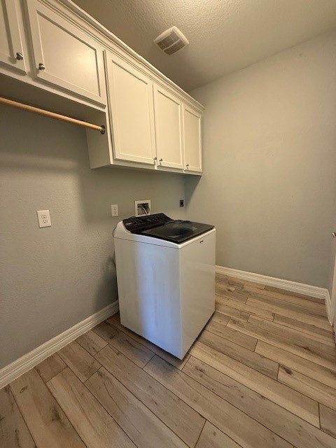 1541 Primrose Street Conroe, TX 77385 - Photo 22 of 25 a room with washing machine
