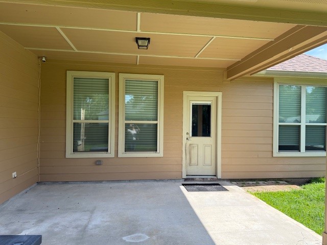 1541 Primrose Street Conroe, TX 77385 - Photo 23 of 25 a view of entrance gate of a house with a yard