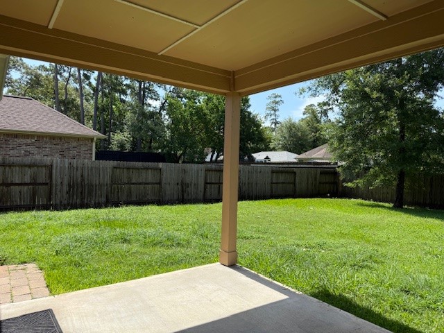 1541 Primrose Street Conroe, TX 77385 - Photo 24 of 25 a view of a backyard with pathway