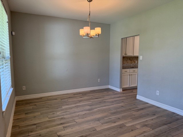 1541 Primrose Street Conroe, TX 77385 - Photo 5 of 25 a view of empty room with wooden floor and fan