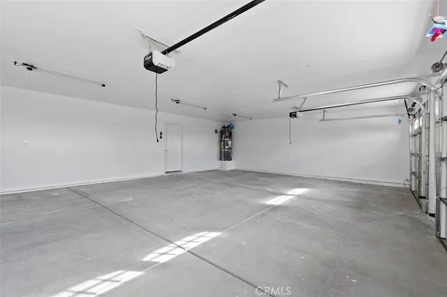 a view of a room with stairs and a chandelier fan