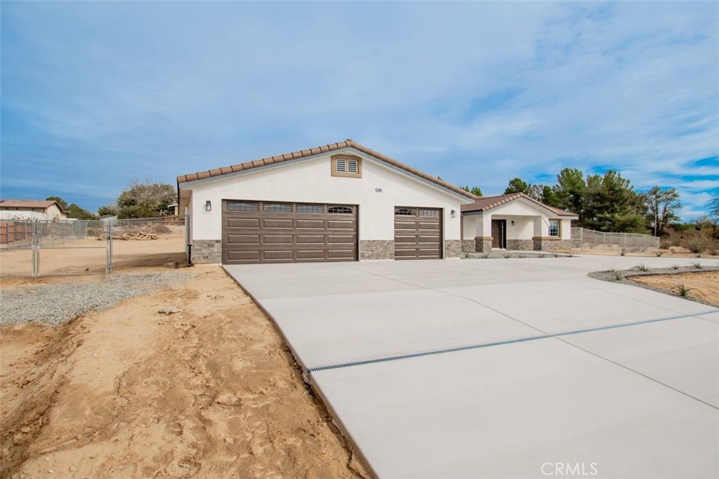 14685 Apple Valley Road Apple Valley, CA 92307 - Photo 6 of 29 a house view with a outdoor space