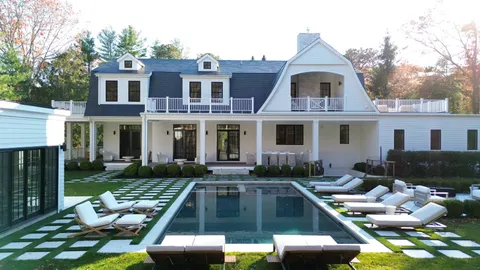 a front view of house with yard outdoor seating and barbeque oven