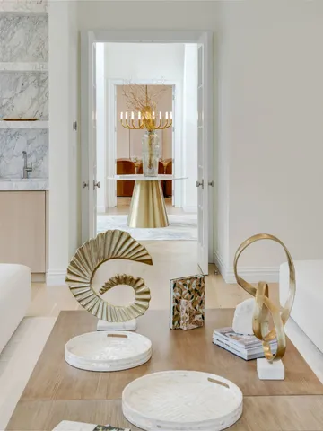 a living room with furniture and a mirror