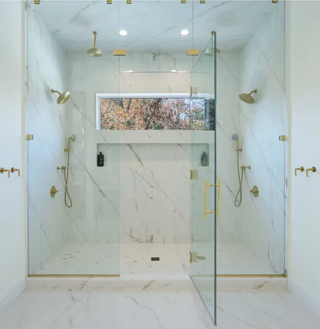 a bathroom with a sink vanity and mirror