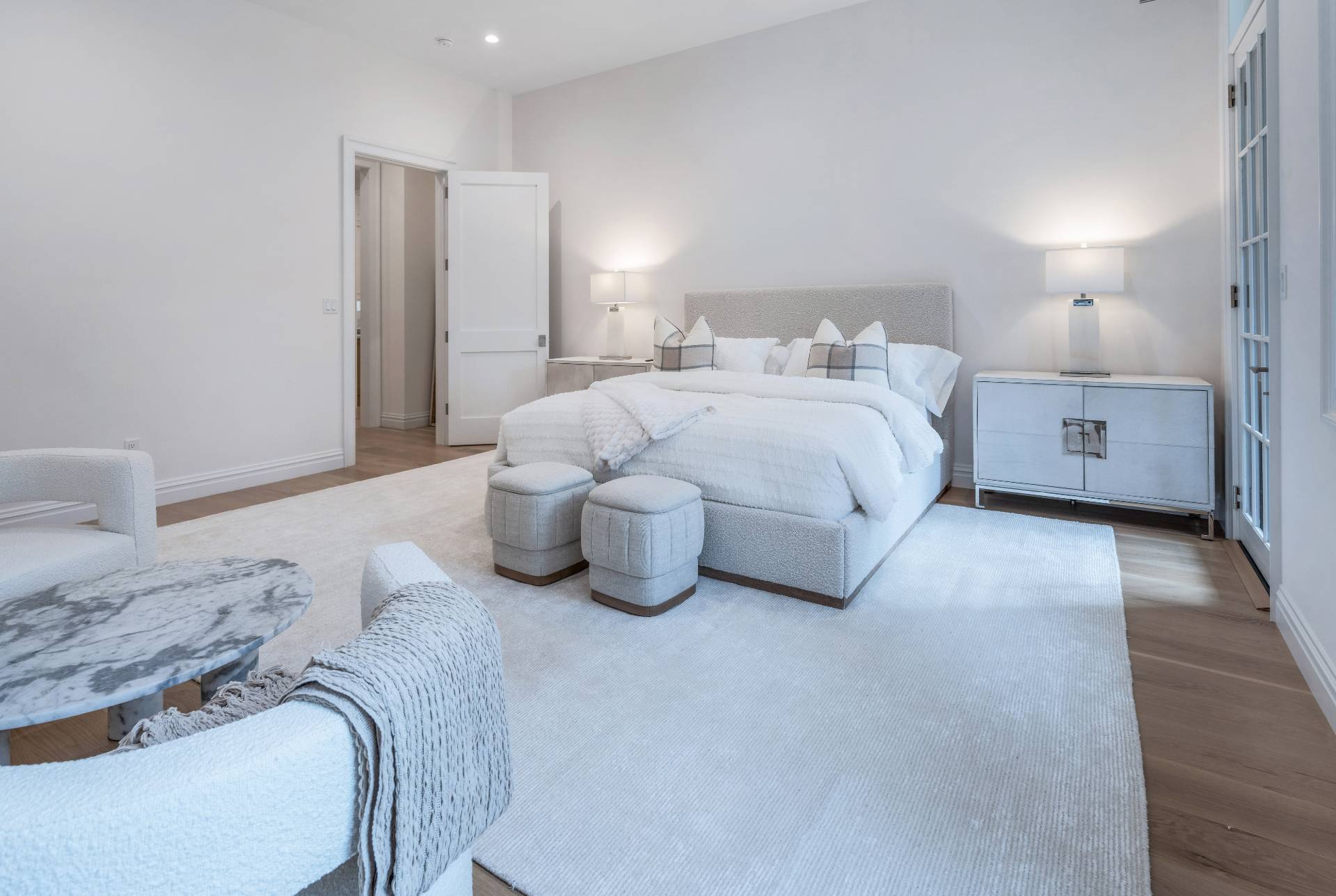 73 Wainscott Stone Road Wainscott, NY 11975 - Photo 27 of 27 a bedroom with a bed and a view of en suite bathroom