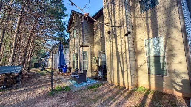 250 Sylvan Loop Fayetteville, GA 30214 - Photo 15 of 18 a view of a brick house with many windows next to a road