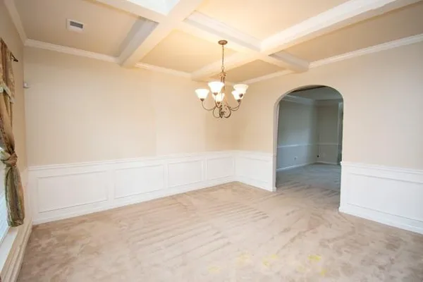 a view of a chandelier in big room