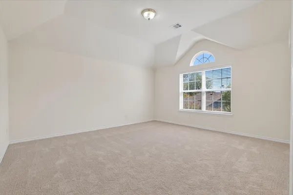 a view of empty room with windows