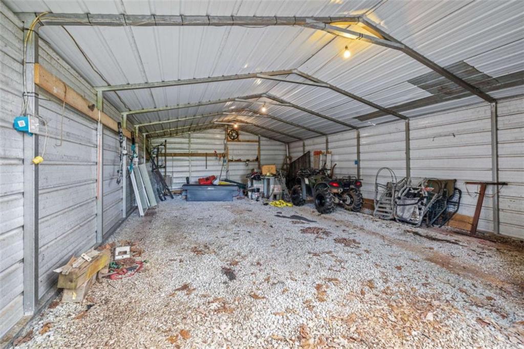 131 Caudell Drive Lula, GA 30554 - Photo 53 of 58 a view of a garage with a table and chairs