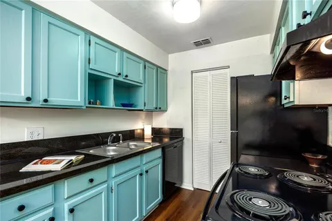 a kitchen with a sink and cabinets