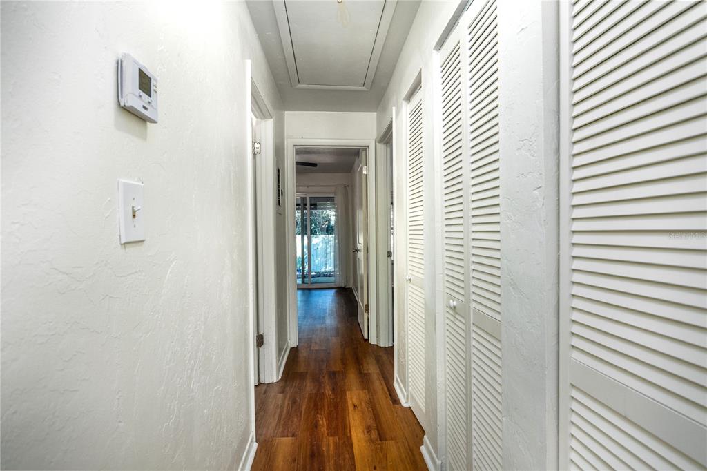 6708 Southwest 45th Avenue Gainesville, FL 32608 - Photo 14 of 40 a view of a hallway with wooden floor