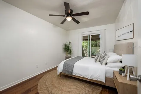 a bedroom with a bed and window