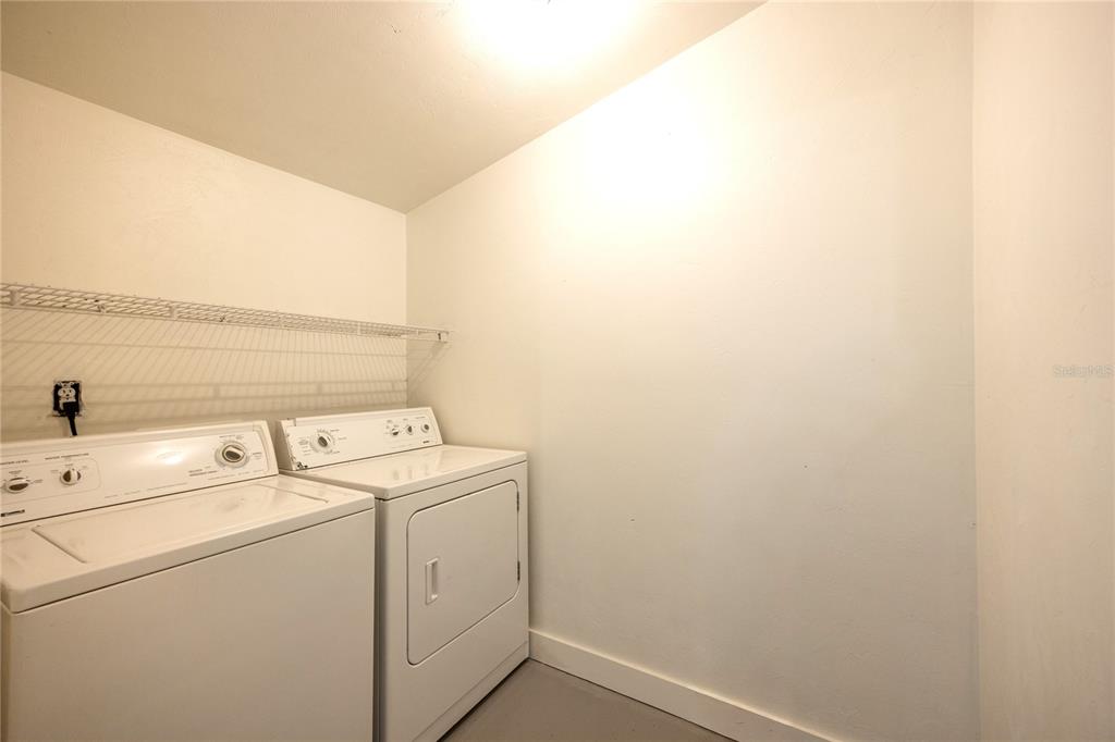 6708 Southwest 45th Avenue Gainesville, FL 32608 - Photo 19 of 40 a view of storage and utility room with washer and dryer