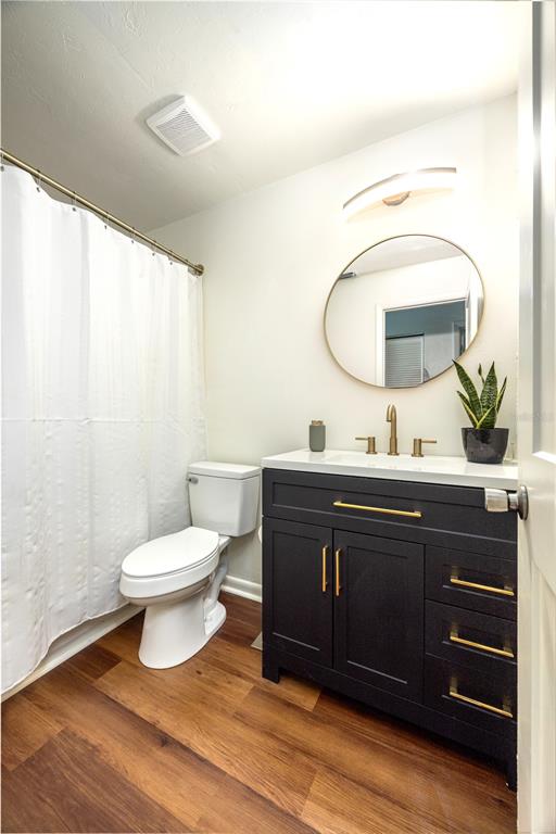 6708 Southwest 45th Avenue Gainesville, FL 32608 - Photo 26 of 40 a bathroom with a double vanity sink and a mirror