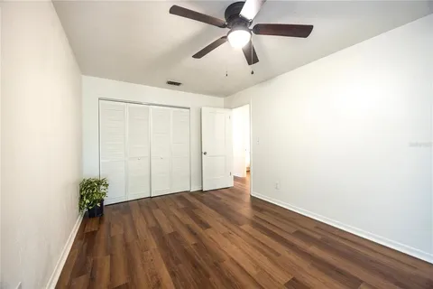 a bedroom with a bed and a television