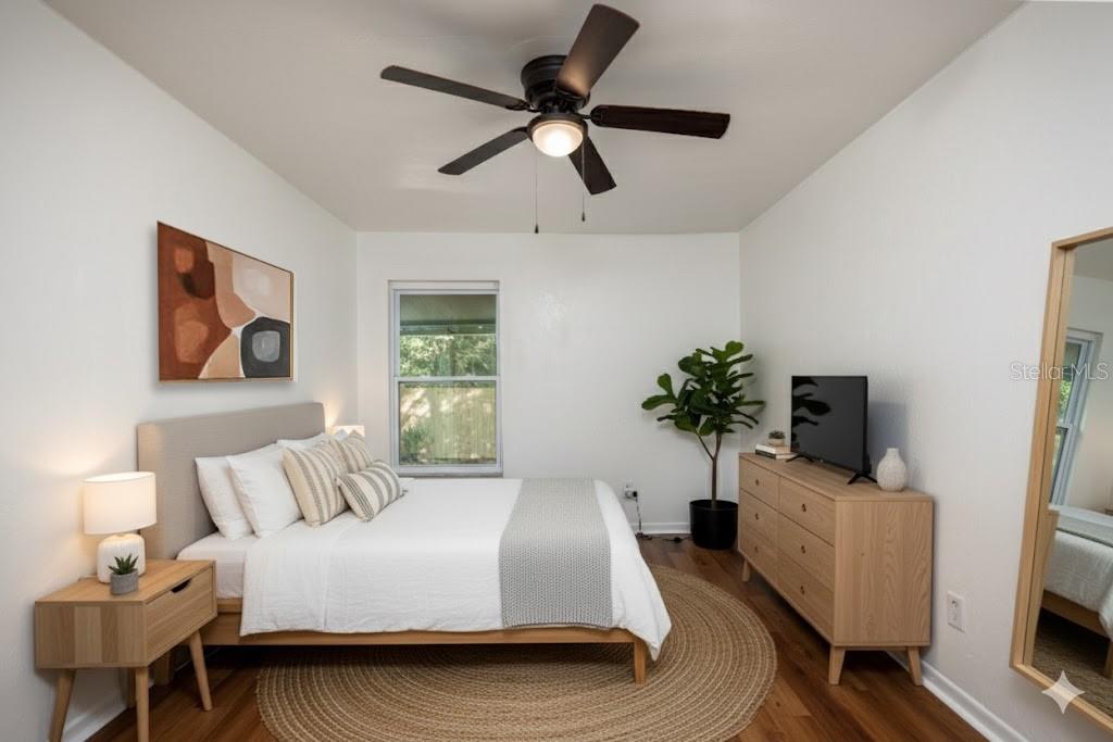 6708 Southwest 45th Avenue Gainesville, FL 32608 - Photo 29 of 40 a bedroom with a bed and a television