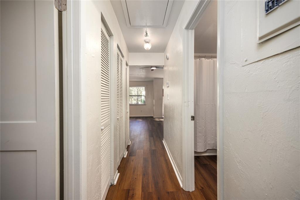 6708 Southwest 45th Avenue Gainesville, FL 32608 - Photo 31 of 40 a view of a hallway with wooden floor and staircase
