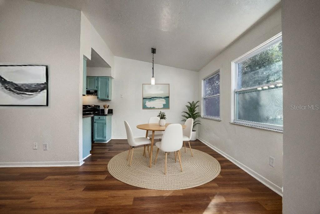 6708 Southwest 45th Avenue Gainesville, FL 32608 - Photo 5 of 40 a dining room with furniture a window and wooden floor