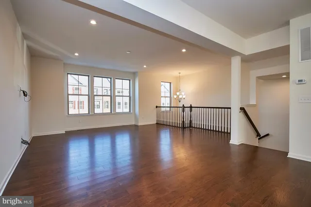 a view of an entryway with wooden floor