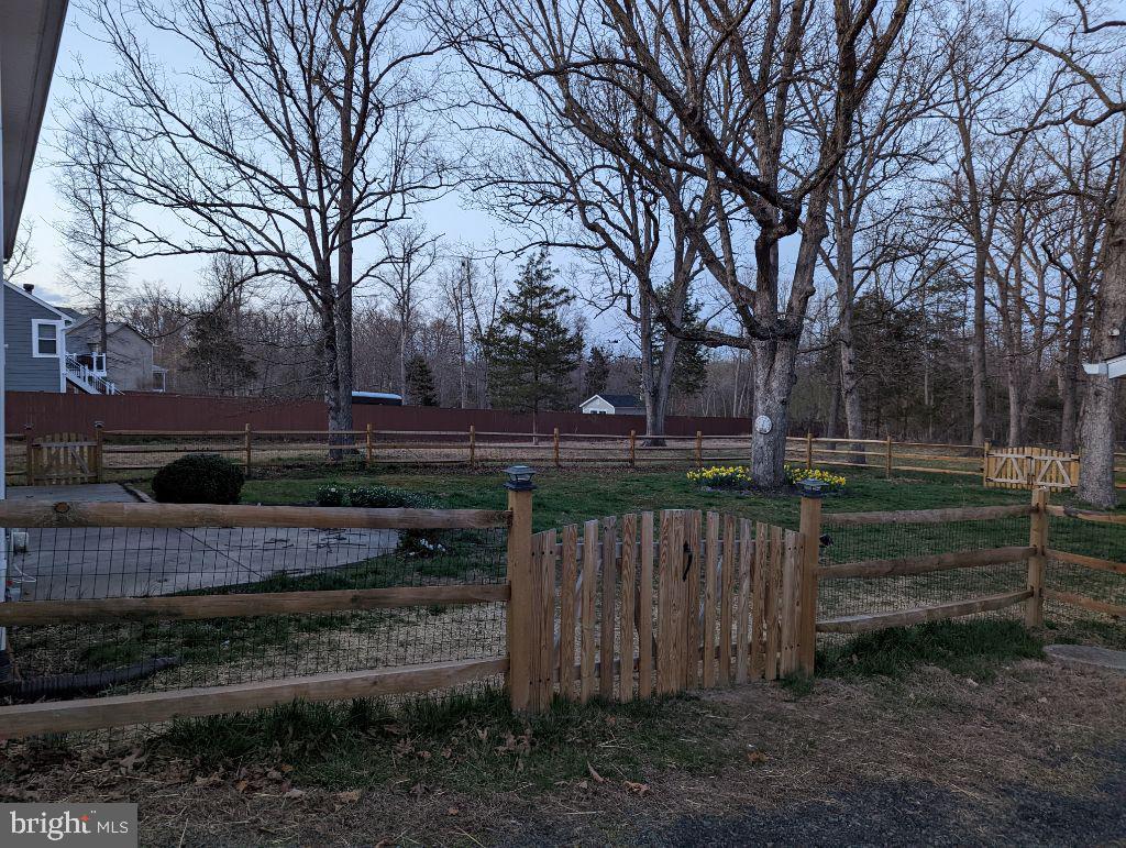 19822 Smith Circle Ashburn, VA 20147 - Photo 52 of 52 Lot extends well past fence, into tree line.