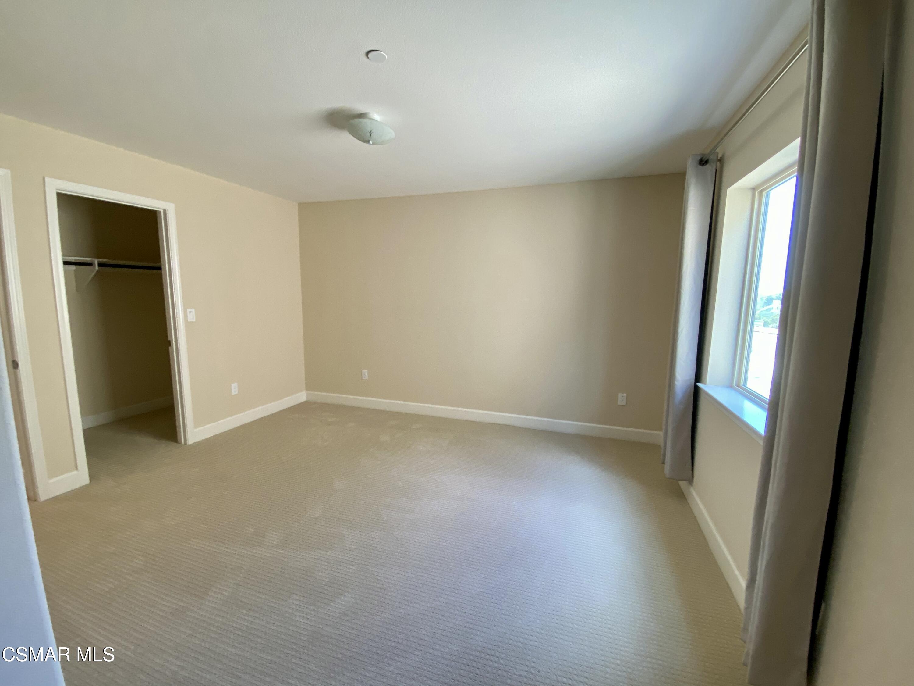 7085 Crozet Avenue Moorpark, CA 93021 - Photo 14 of 22 an empty room with windows and entrance