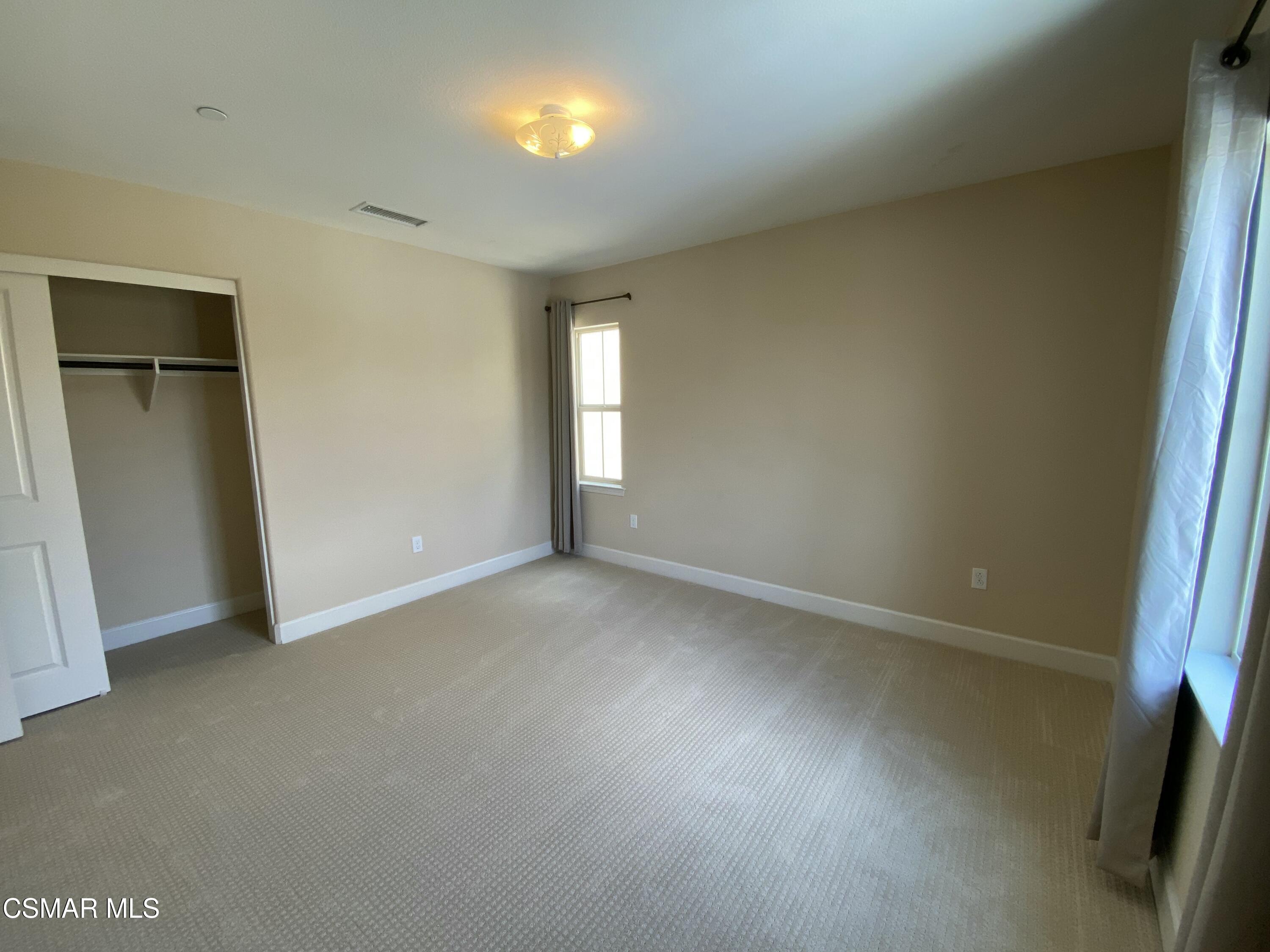7085 Crozet Avenue Moorpark, CA 93021 - Photo 16 of 22 an empty room with windows and closet