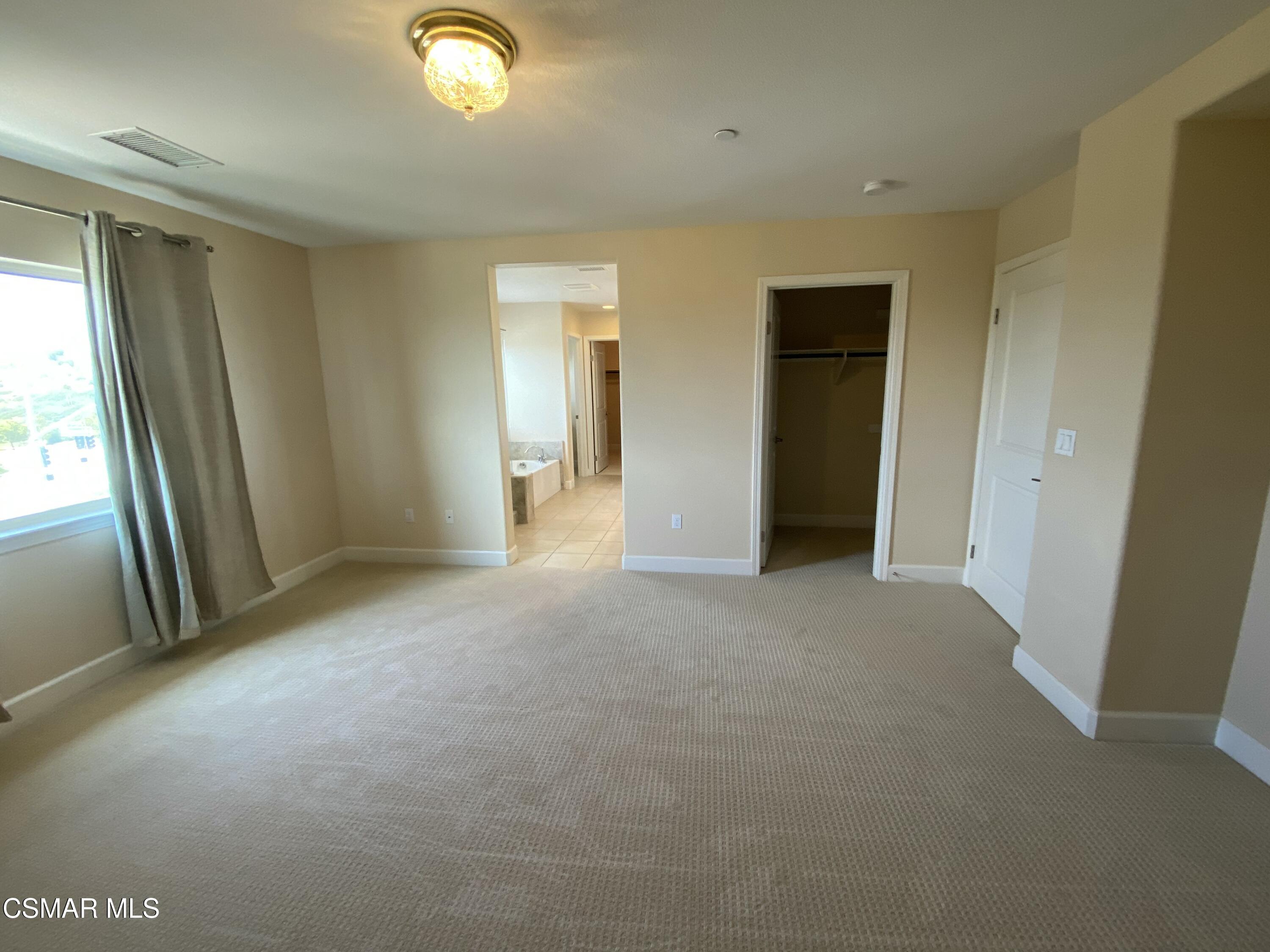 7085 Crozet Avenue Moorpark, CA 93021 - Photo 9 of 22 a view of empty room with window