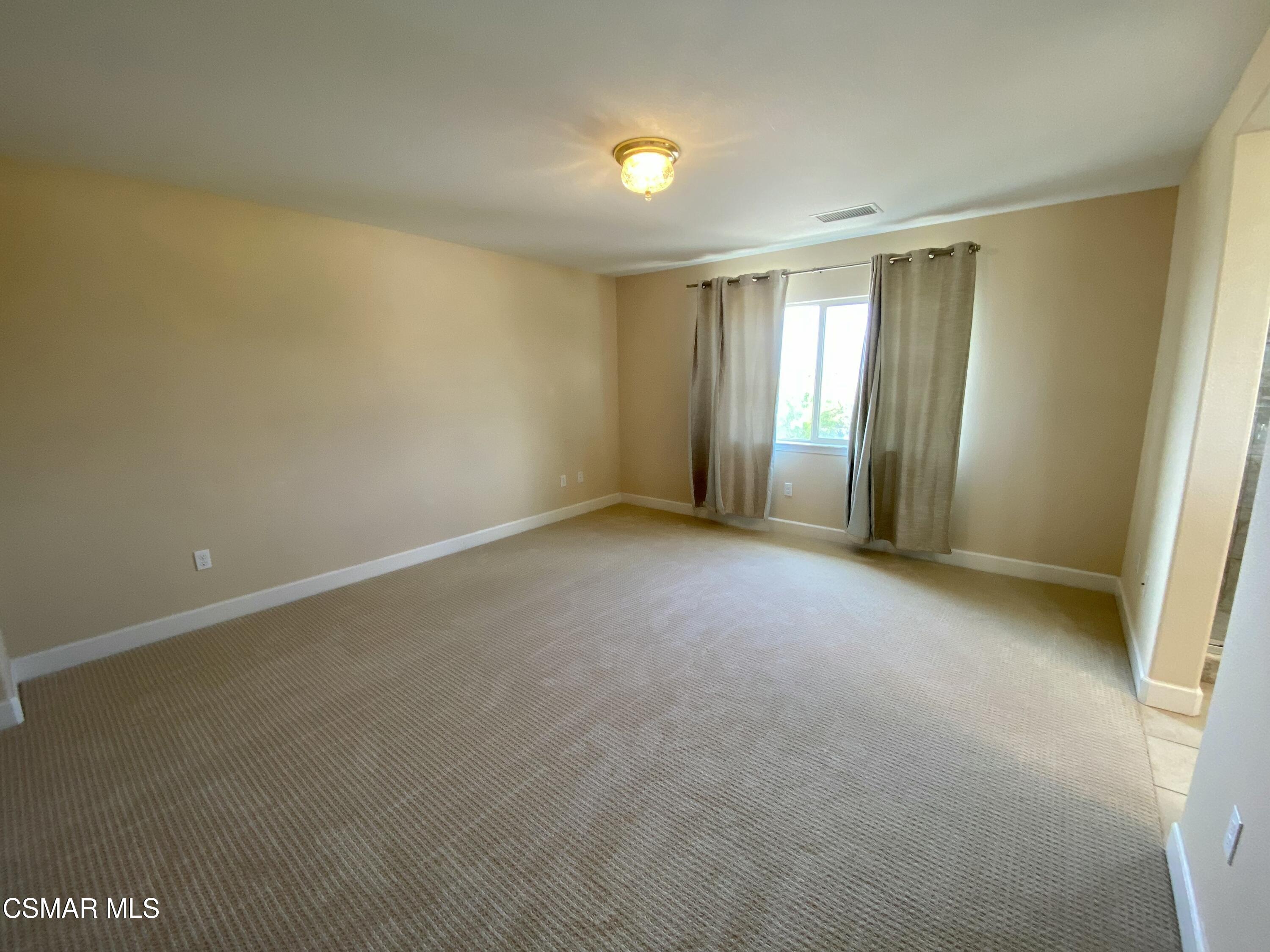 7085 Crozet Avenue Moorpark, CA 93021 - Photo 10 of 22 a view of an empty room with a window