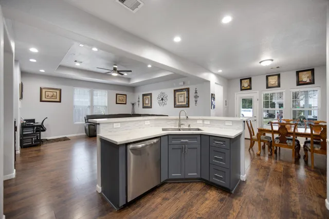 a view of a dining room with furniture and wooden floor