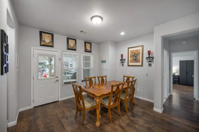 a bedroom with a large bed and a tv