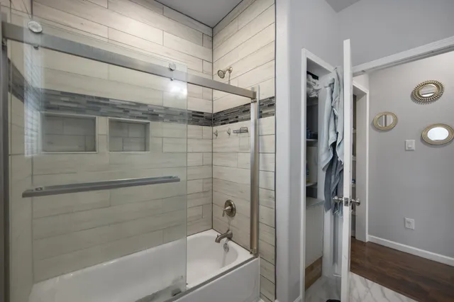 a bedroom with bed and a window