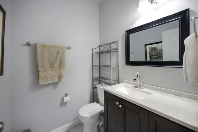 a view of a patio with a table and chairs