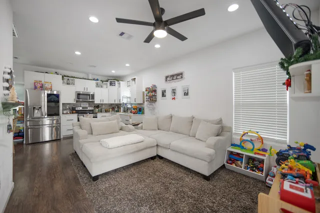 a bedroom with a bed and a desk in it