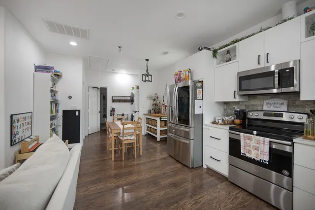 a bathroom with a sink mirror and shower