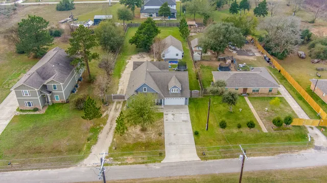 an aerial view of a house with a garden