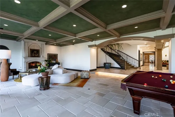 a living room with furniture a couch and a window