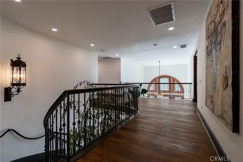 a bedroom with a bed a couch and a large window