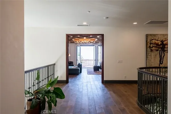 a bedroom with a bed window and couch