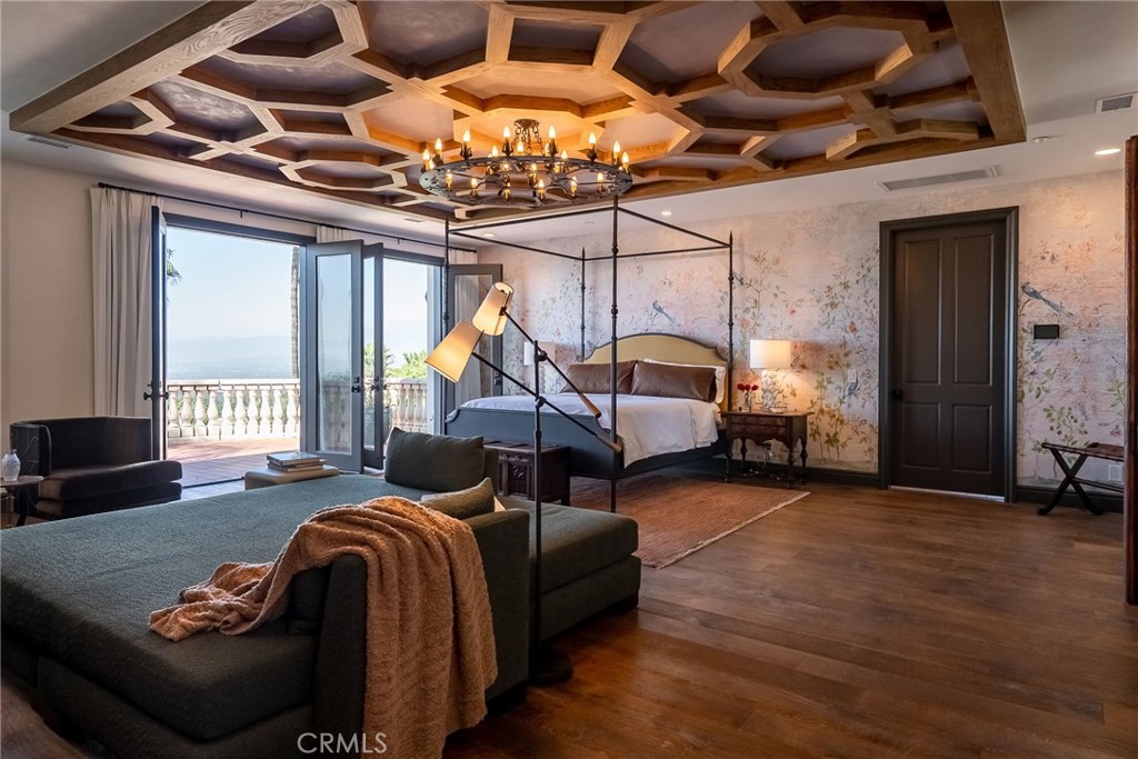 2019 Polo Court Riverside, CA 92506 - Photo 32 of 75 a bedroom with furniture and a chandelier