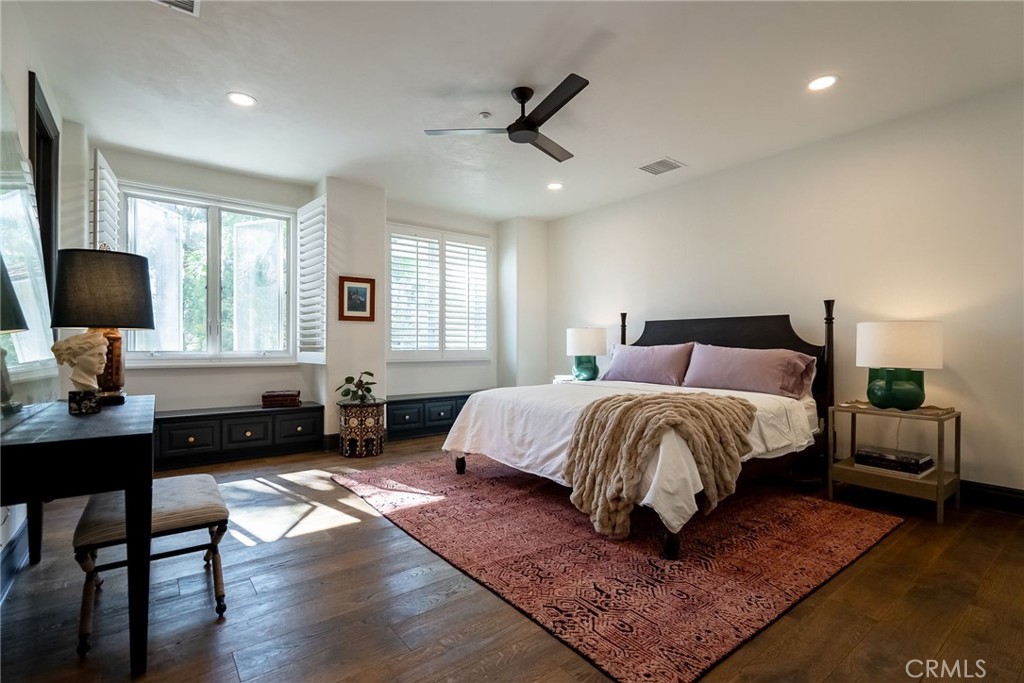 2019 Polo Court Riverside, CA 92506 - Photo 45 of 75 a bedroom with a bed a couch and a large window