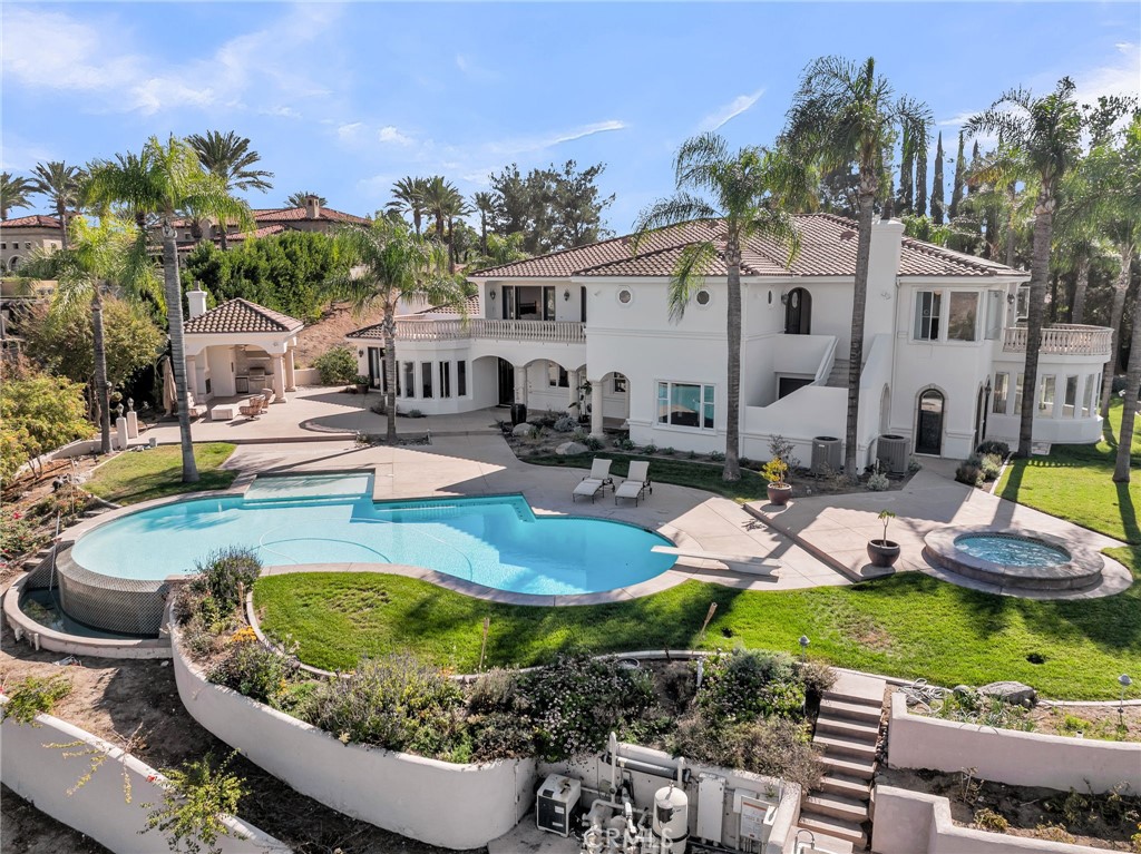 2019 Polo Court Riverside, CA 92506 - Photo 65 of 75 a swimming pool with outdoor seating and yard