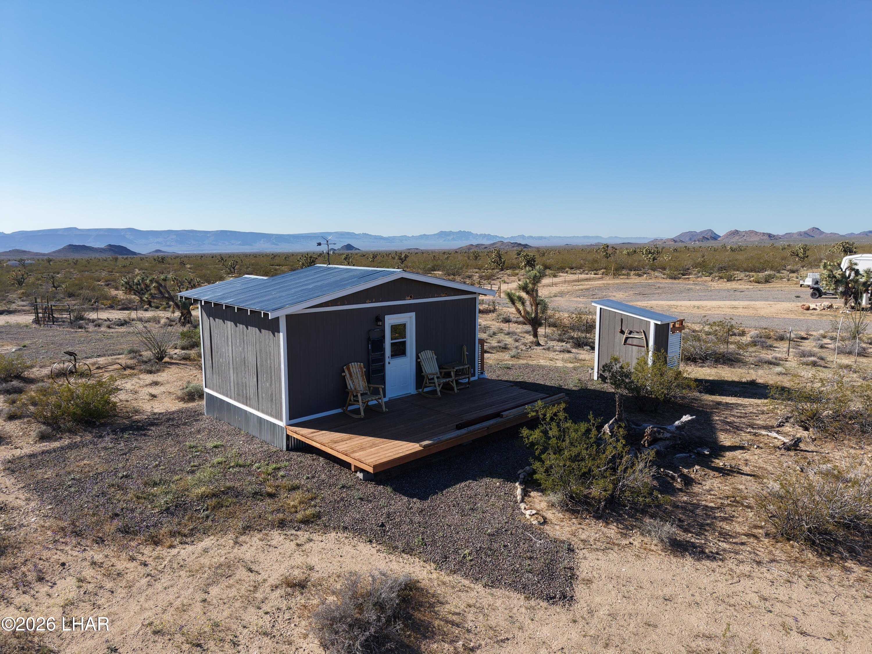 127 South Carrow Road Yucca, AZ 86438 - Photo 12 of 39 a view of a house with a yard