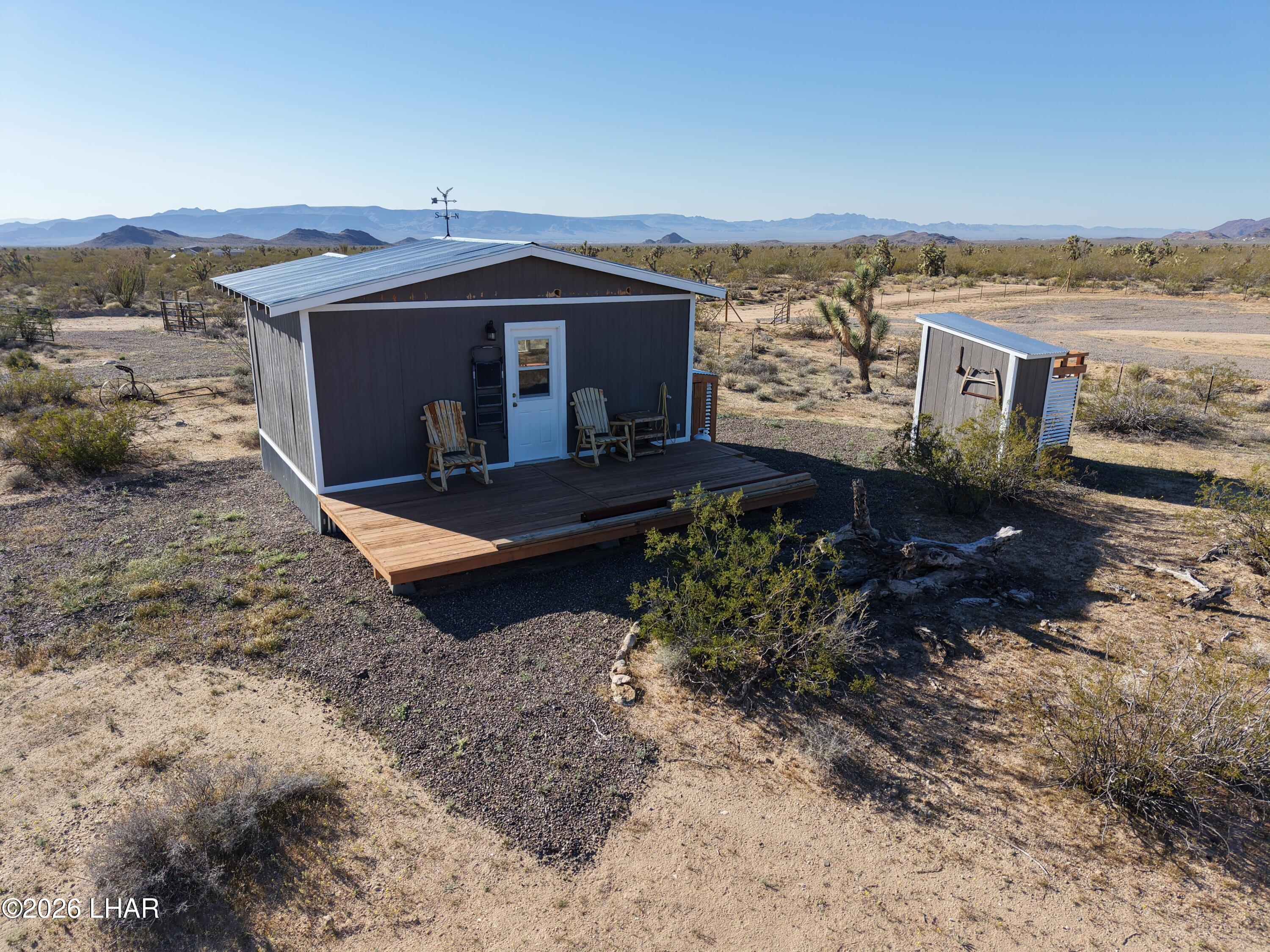 127 South Carrow Road Yucca, AZ 86438 - Photo 13 of 39 a view of a terrace with a garden